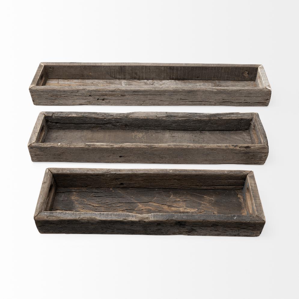 Three rustic wooden trays on a white background.