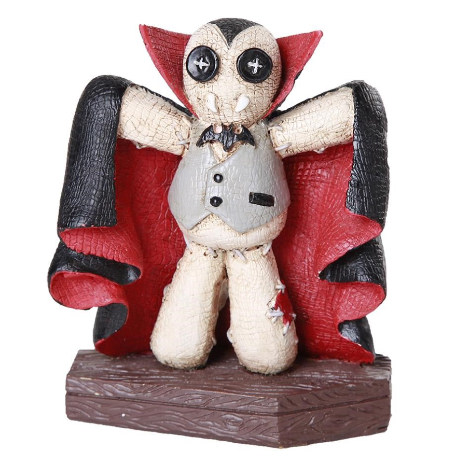 Vampire-themed plush toy with button eyes and red cape.