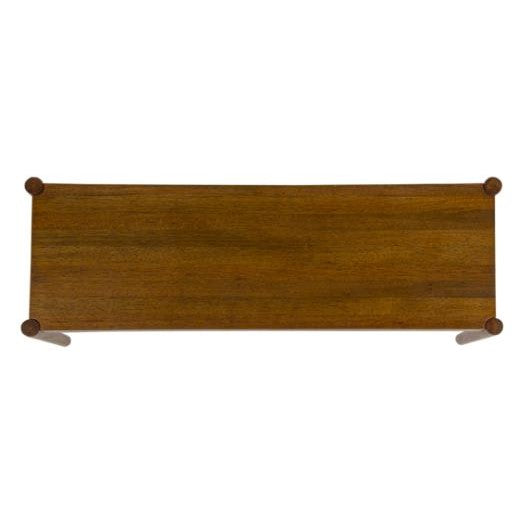 Wooden rectangular table viewed from above.