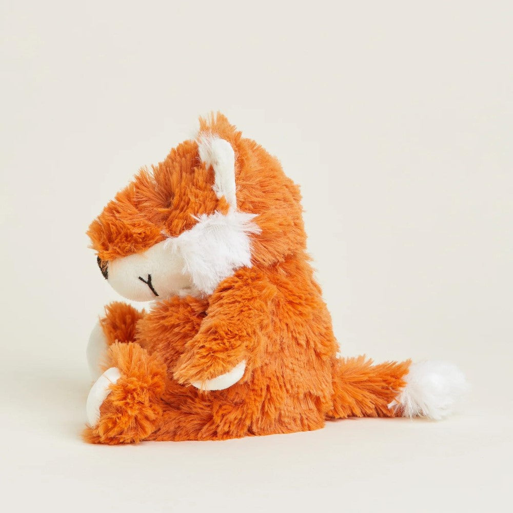 Fluffy orange and white fox plush toy sitting upright.