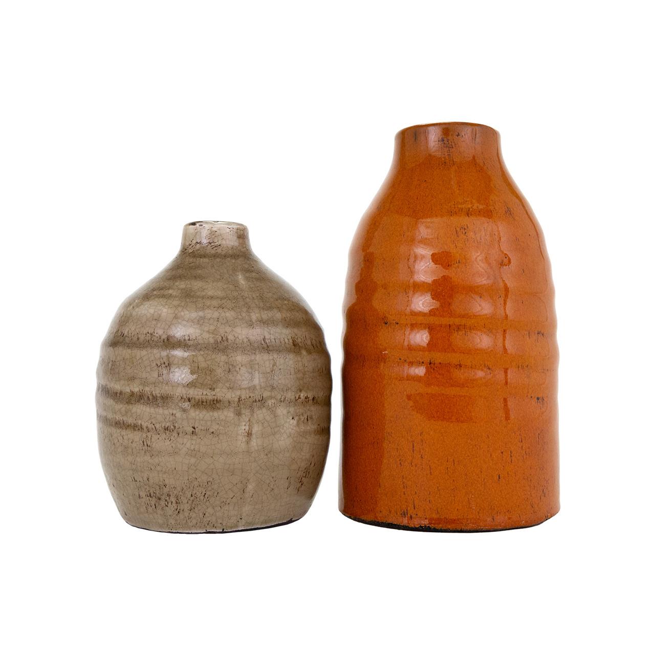 Two ceramic vases: one beige, one orange, with a textured finish.