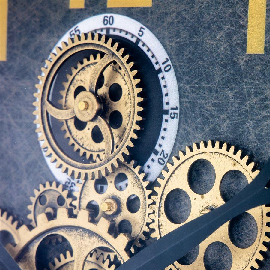 Close-up of interlocking gears on a mechanical clock face.