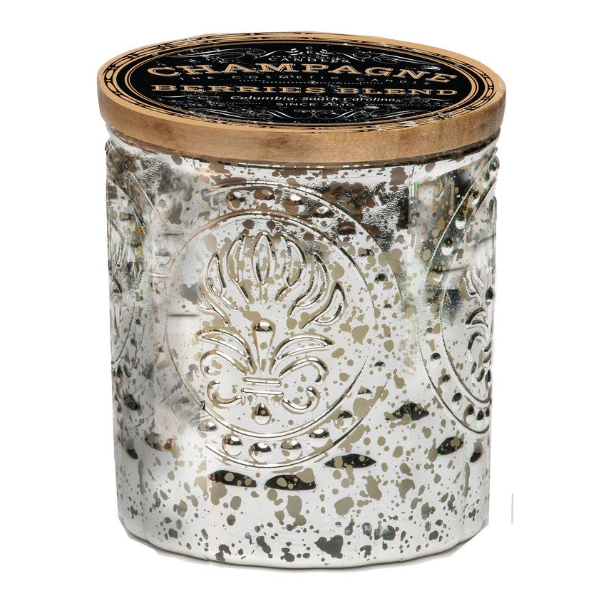 Ornate glass candle jar with gold lid and decorative designs.