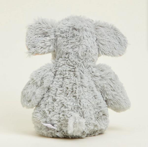 Fluffy gray elephant plush toy viewed from behind.