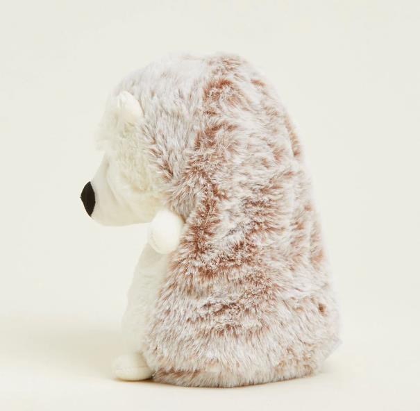 Fluffy hedgehog plush toy viewed from the side.