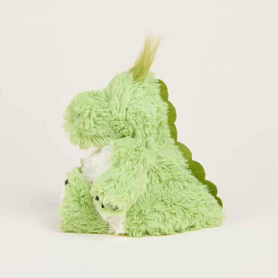 Fluffy green dinosaur plush toy sitting sideways.