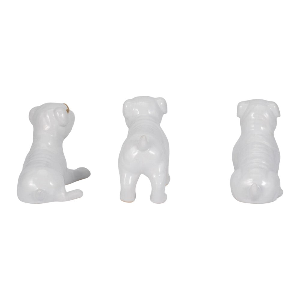 Three white ceramic dog figurines in different poses.