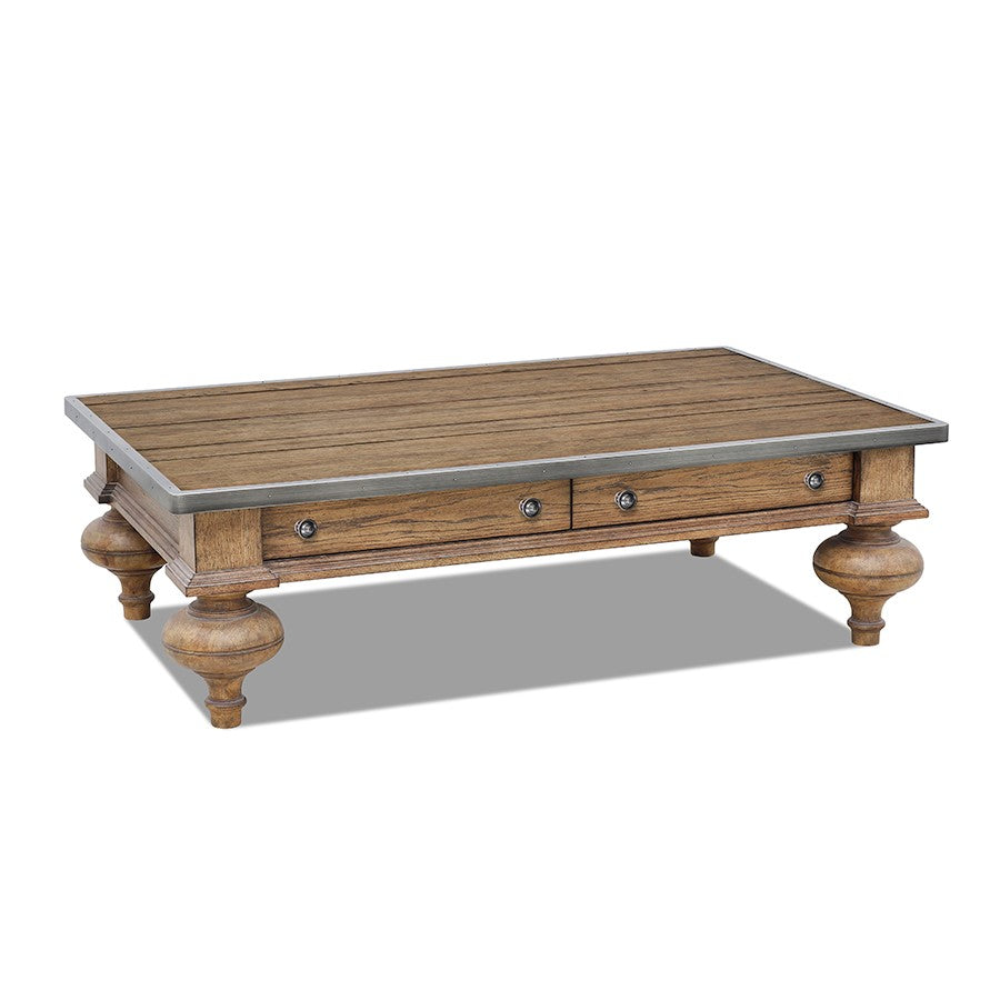 Wooden coffee table with metal trim and four drawers.