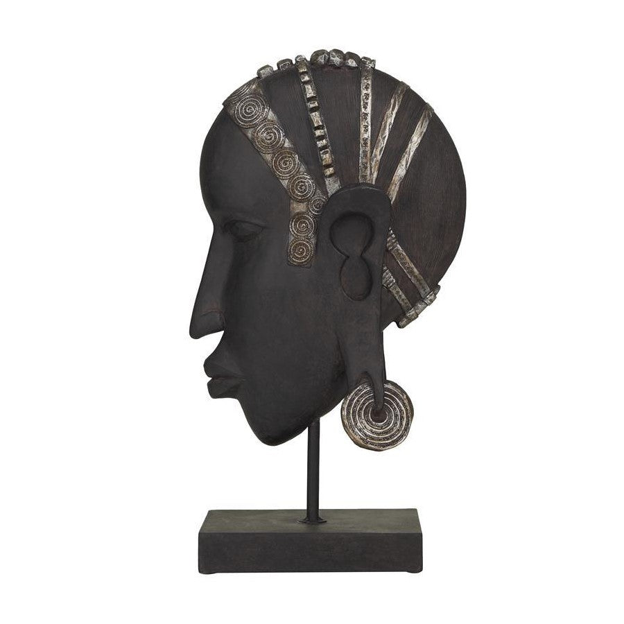Abstract black sculpture of a woman's head with silver accents.