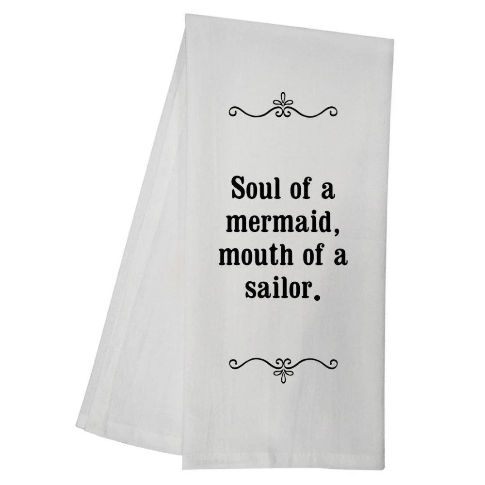 White towel with the quote: "Soul of a mermaid, mouth of a sailor."