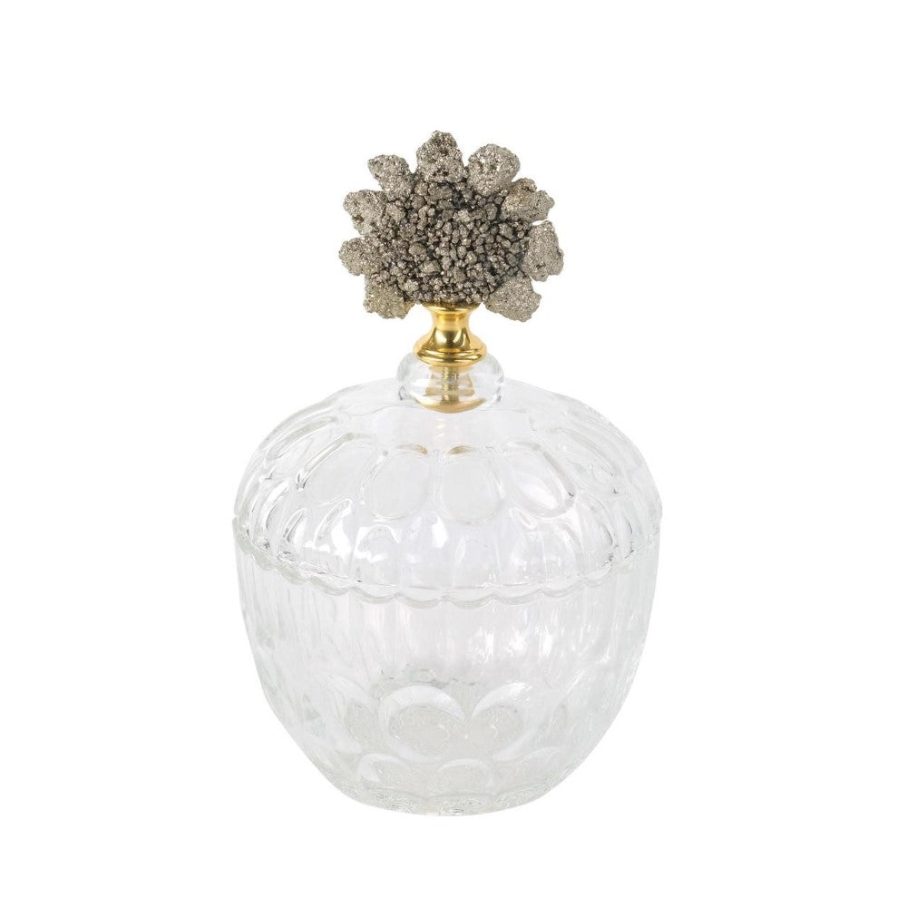Elegant glass jar with ornate lid, featuring a floral motif.
