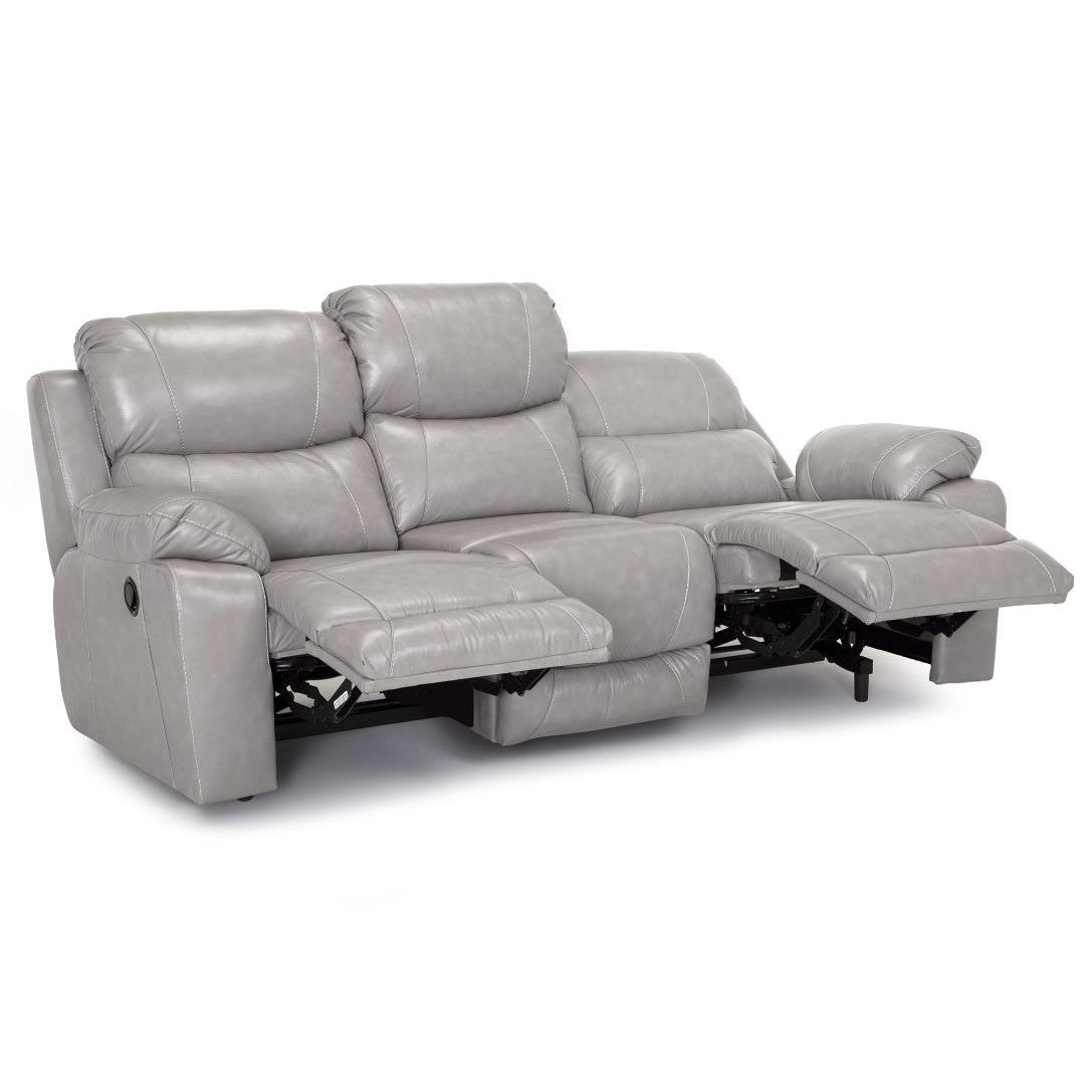 Gray recliner sofa with two open footrests.