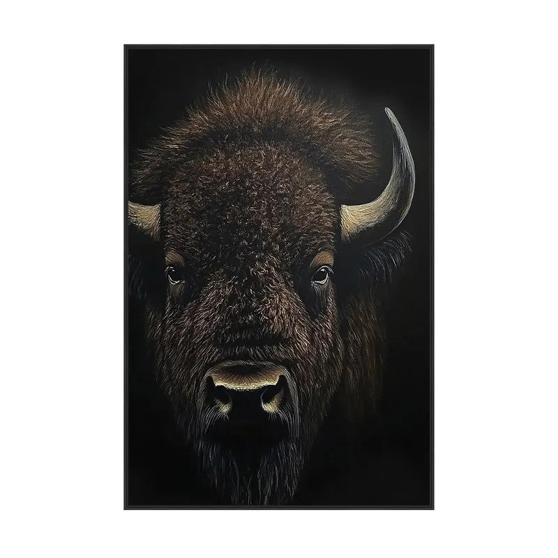 Close-up of a bison against a dark background, showcasing its horns and fur.