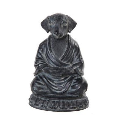 Dog-headed statue in meditative pose, wearing robes.