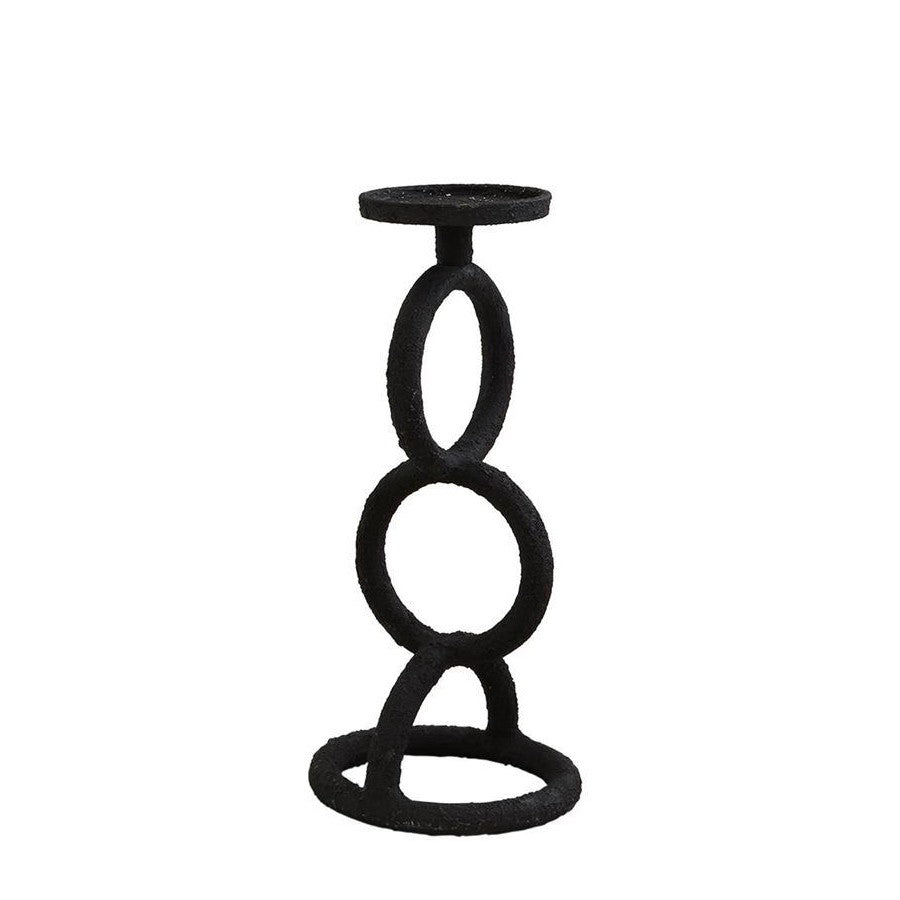 Black ring-shaped modern candle holder on white background.