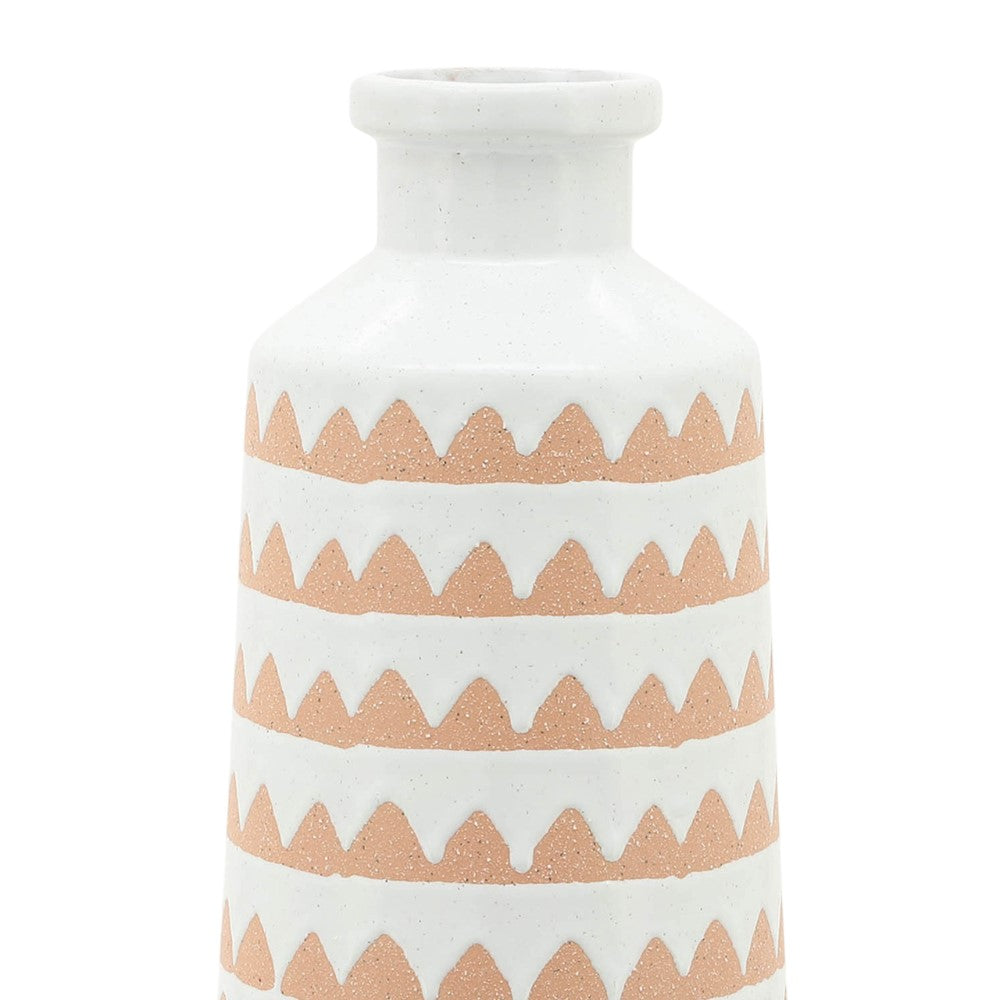 White vase with brown zigzag patterns.
