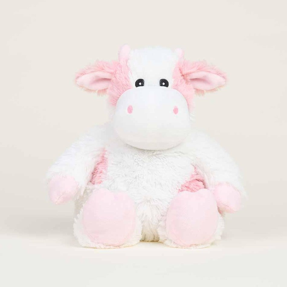 Fluffy pink and white cow plush toy.