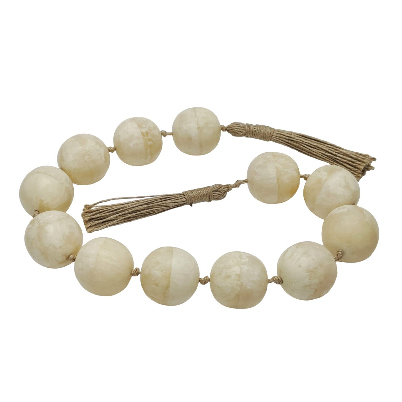 String of large, round, cream-colored beads with tassels.
