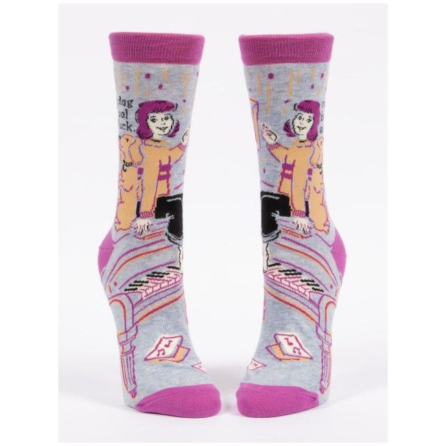 Socks with cartoon woman, dog, and piano design in pink and gray tones.