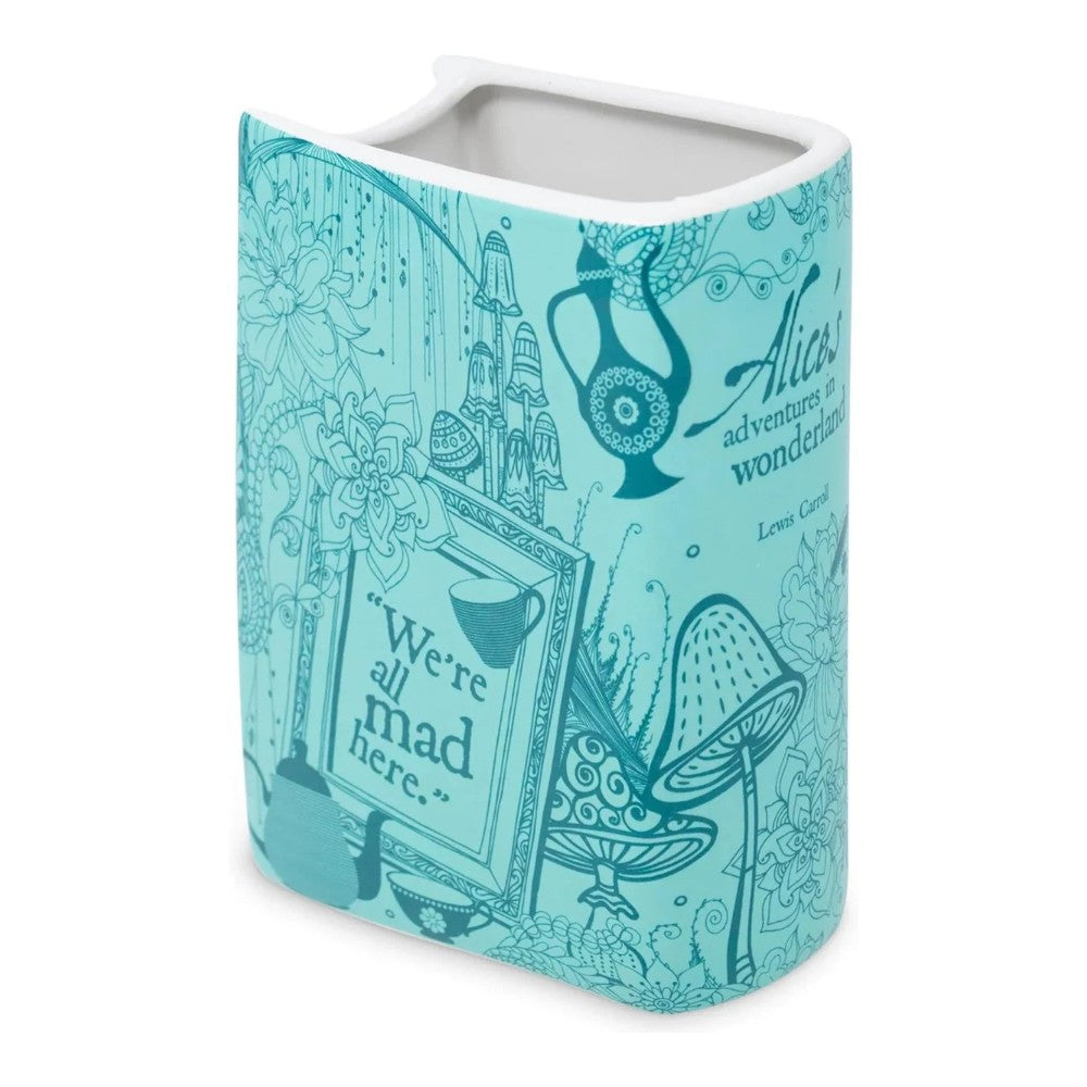 Blue mug with Alice in Wonderland theme and whimsical illustrations.