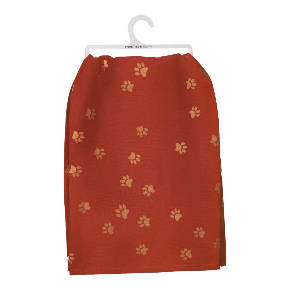 Red towel with golden paw prints, hanging on a white hanger.