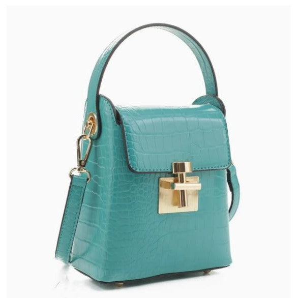 Turquoise textured handbag with gold clasp and handle.