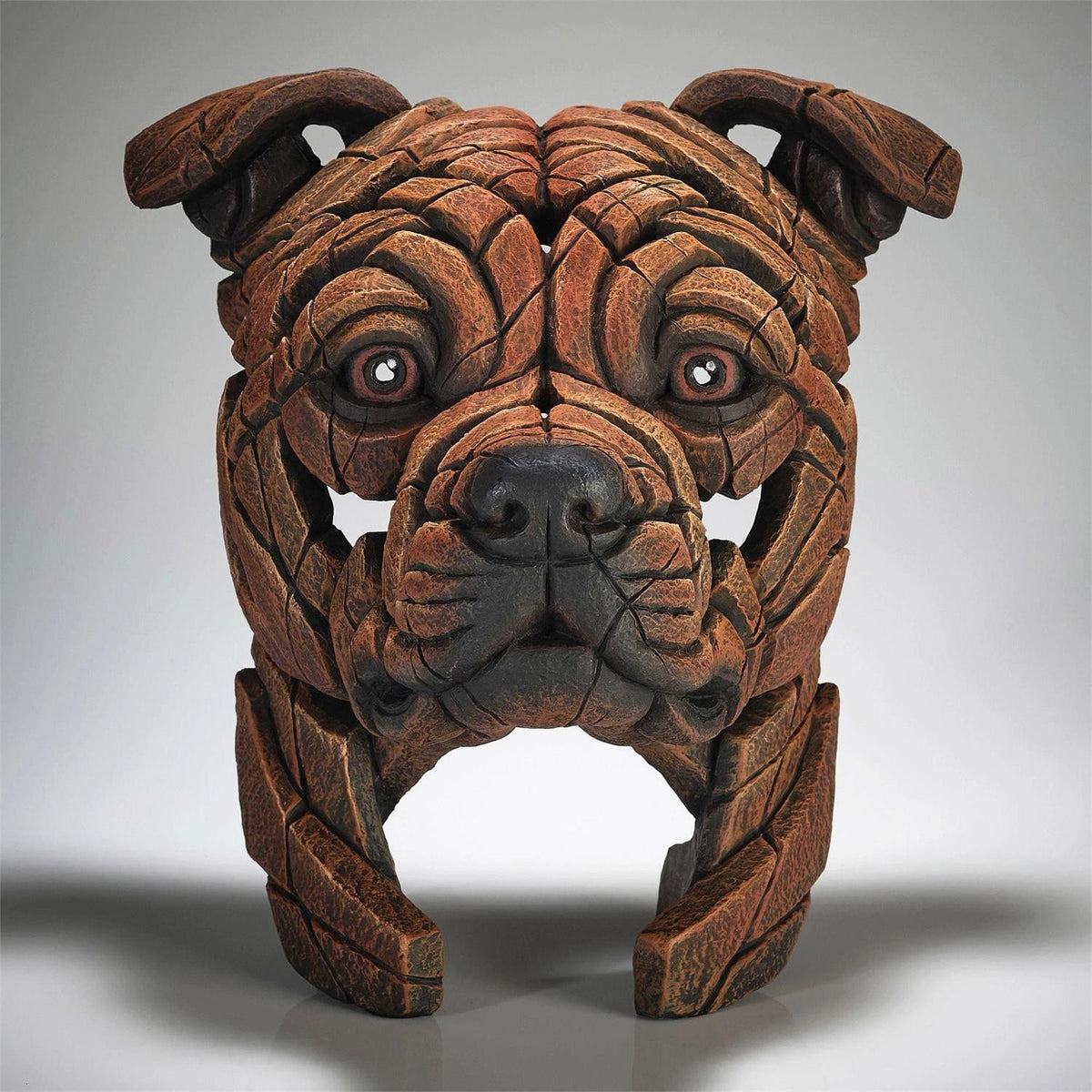 Wooden dog sculpture with a puzzle-like design.