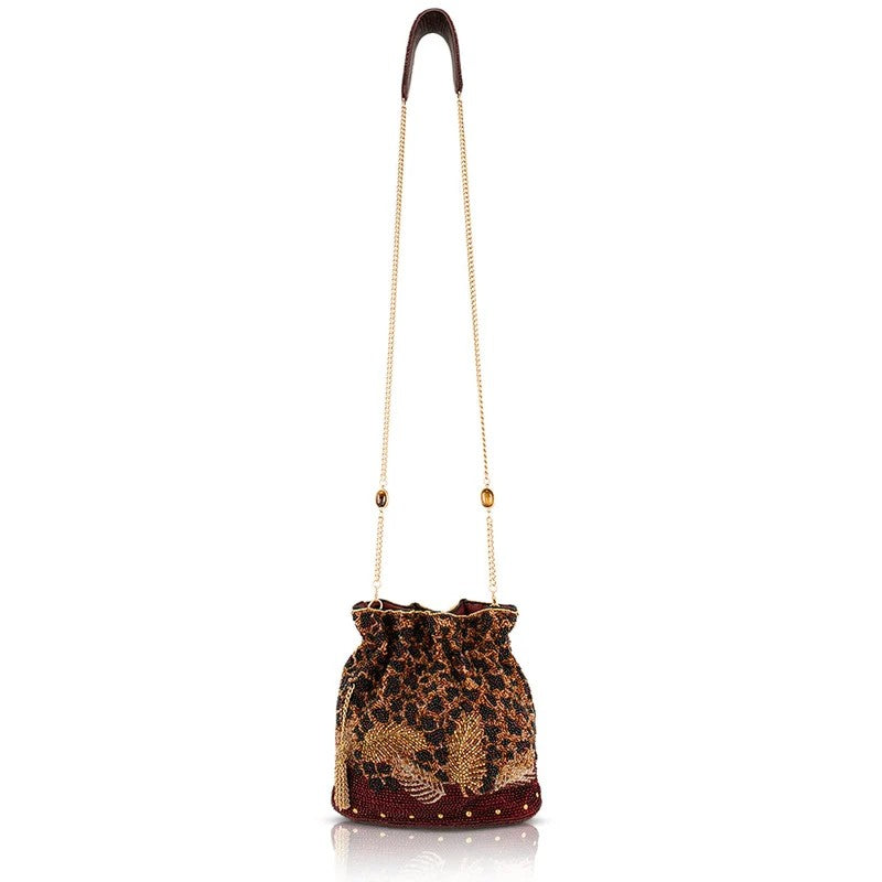 Embroidered drawstring bag with a gold chain strap.