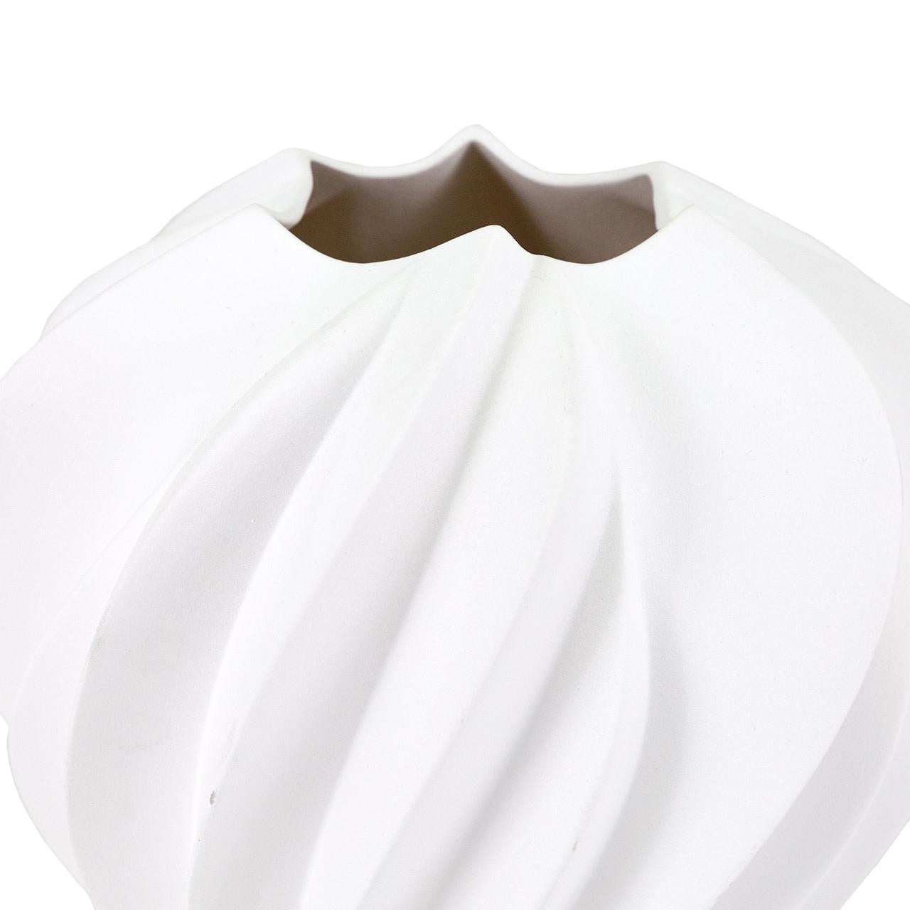 White ceramic vase with a spiral design and a scalloped rim.