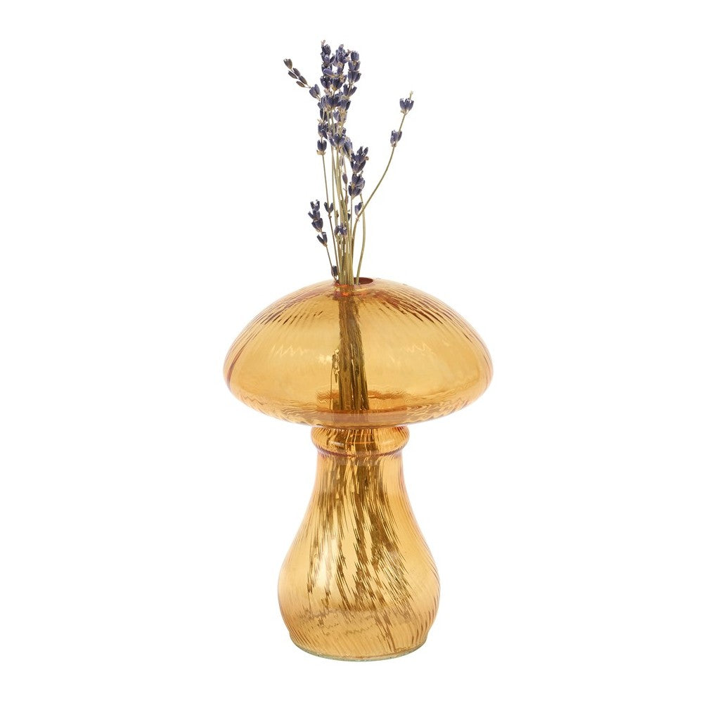 Amber mushroom-shaped vase with lavender sprigs.
