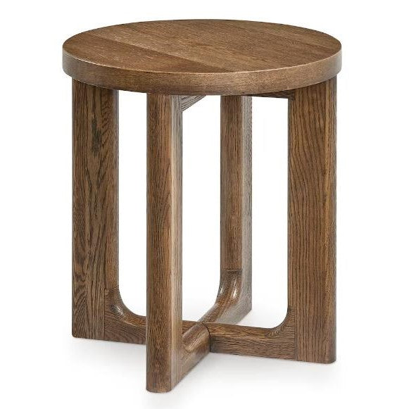 Round wooden side table with unique leg design.