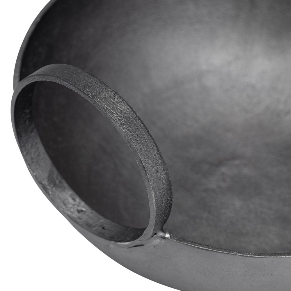 Close-up of a gray metal bowl's handle.