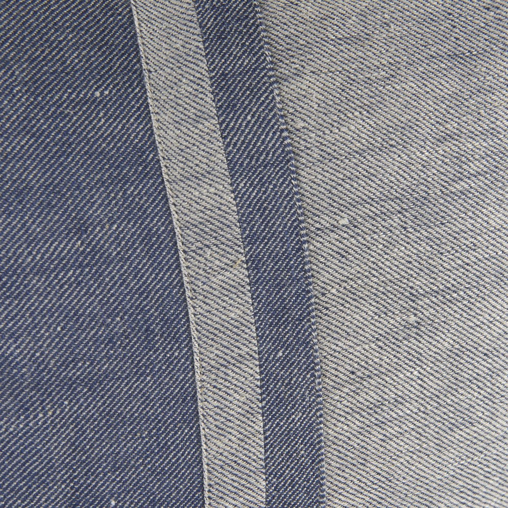 Close-up of blue and white striped denim fabric.