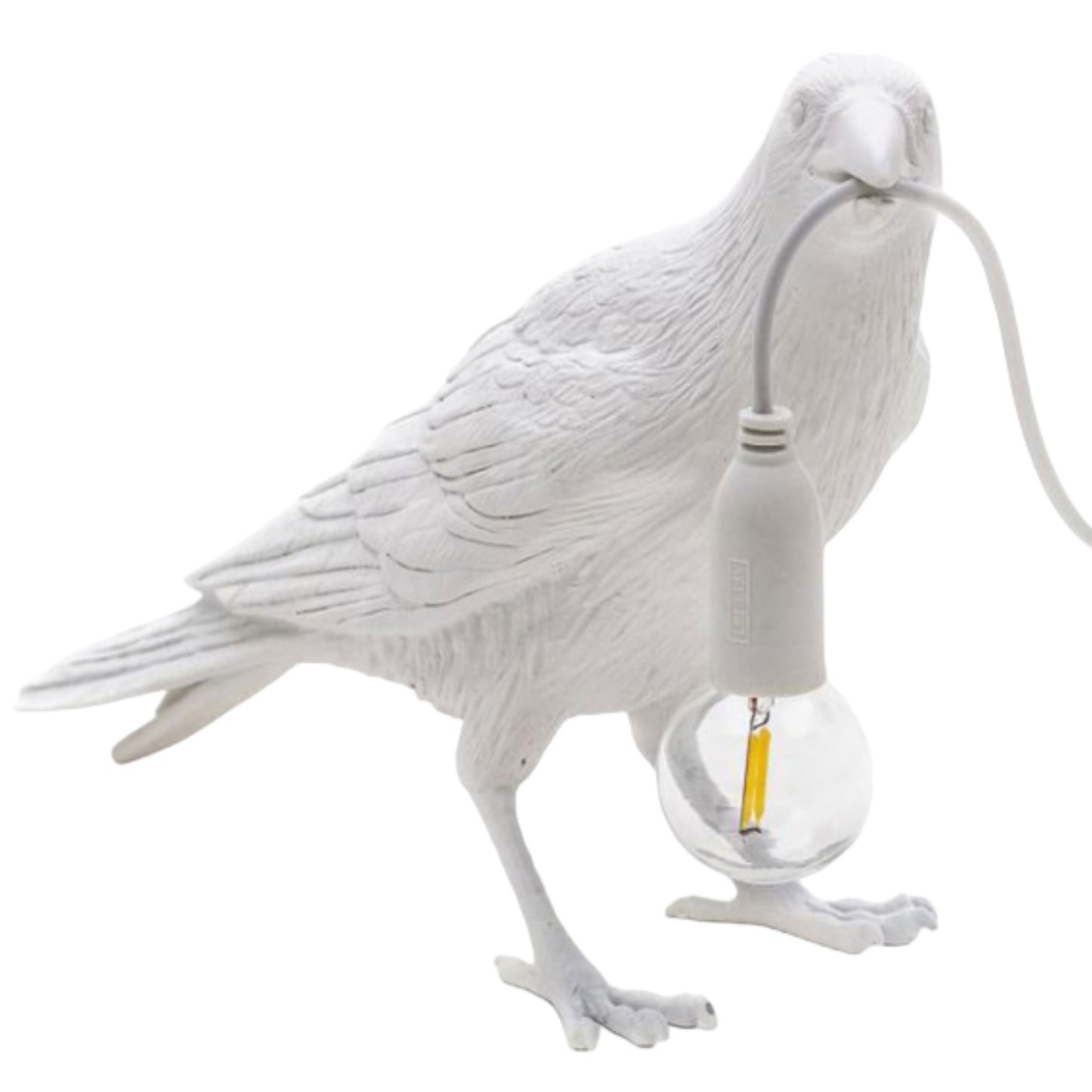 White bird sculpture holding a light bulb in its beak.