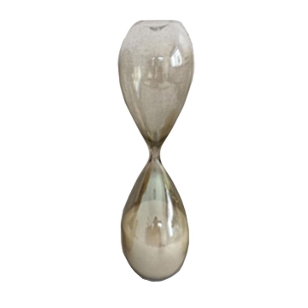 Transparent hourglass with sand flowing inside.
