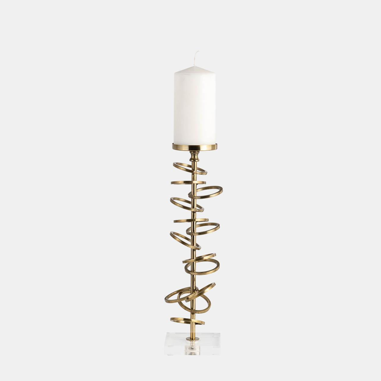 Elegant gold spiral candle holder with white candle.