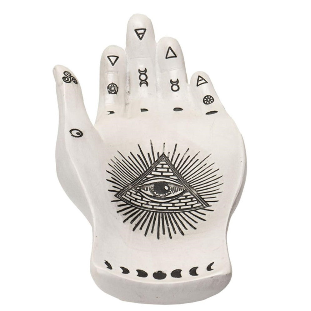 White hand sculpture with mystic symbols and an all-seeing eye.
