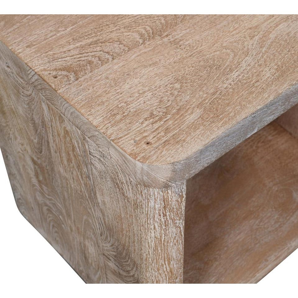 Wooden table corner with curved edge and natural grain pattern.