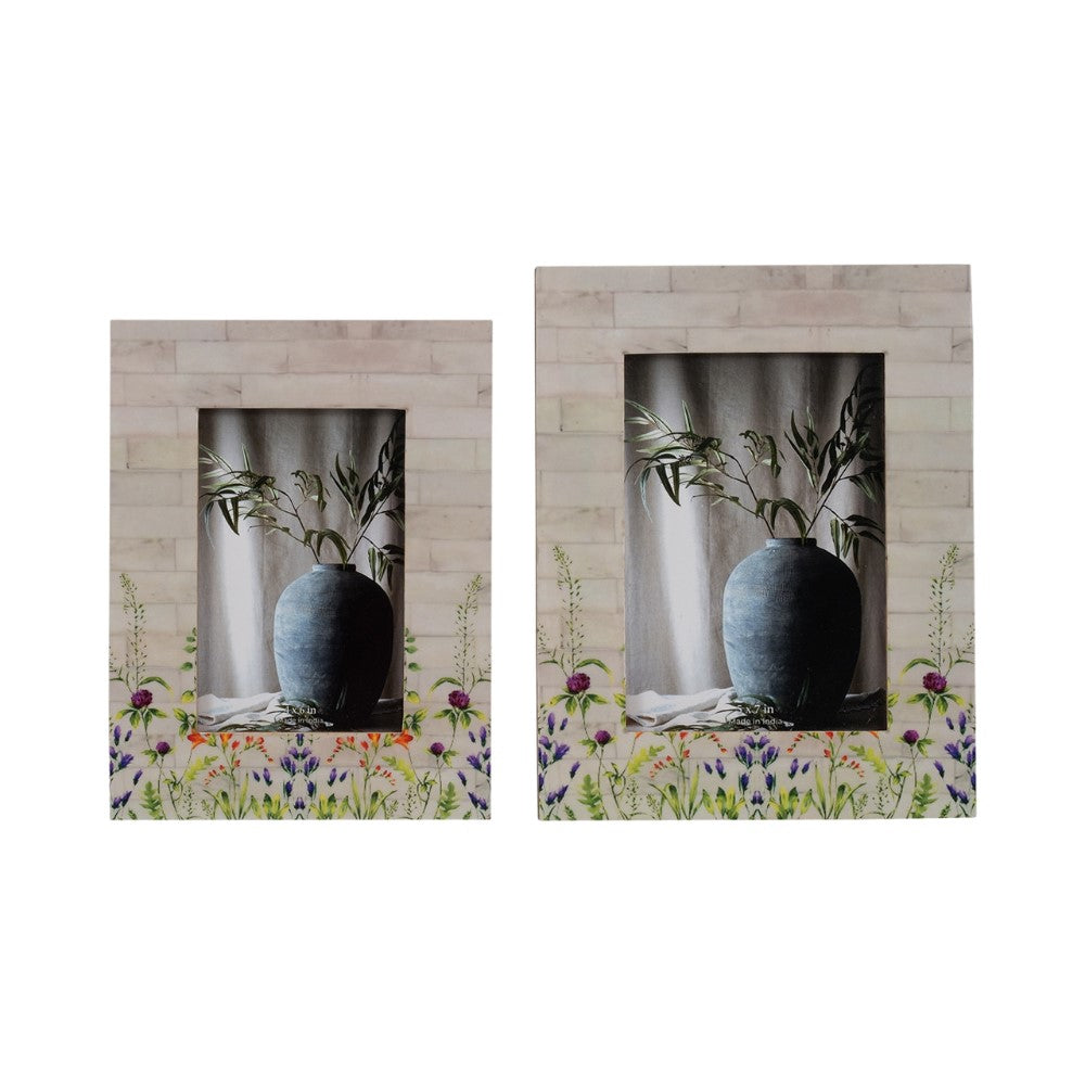 Two photo frames with flower designs, featuring a vase and plant scene.