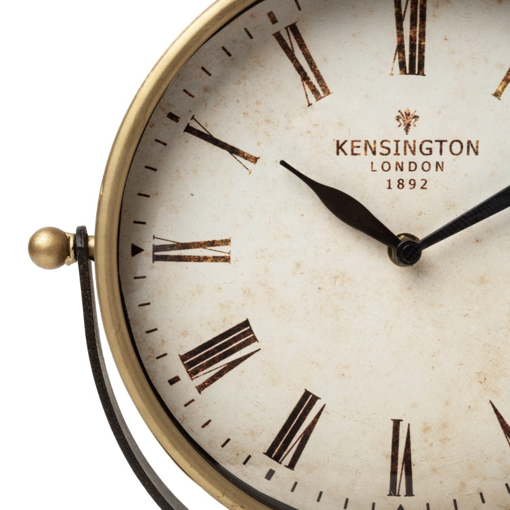 Vintage clock face with Roman numerals and "Kensington, London 1892" text.