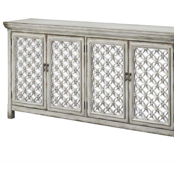 Ornate wooden sideboard with geometric circle pattern doors.
