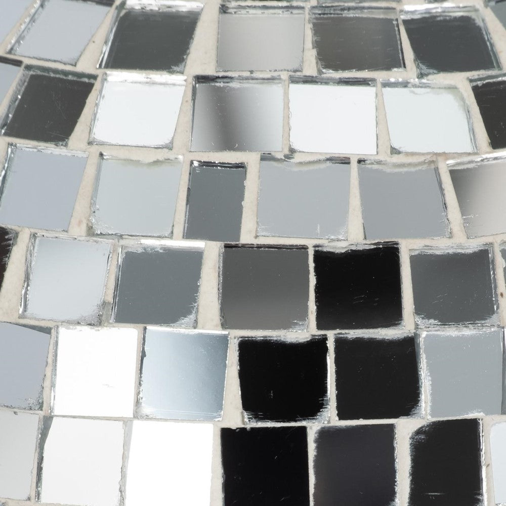 Reflective square tiles in a mosaic pattern.