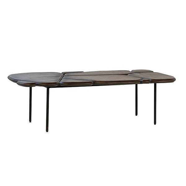 Modern abstract wooden coffee table with thin metal legs.