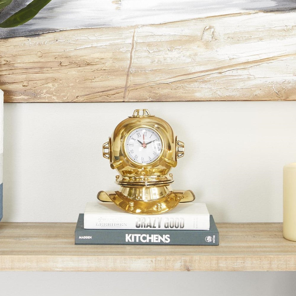 Gold diving helmet clock on shelf above cookbooks.