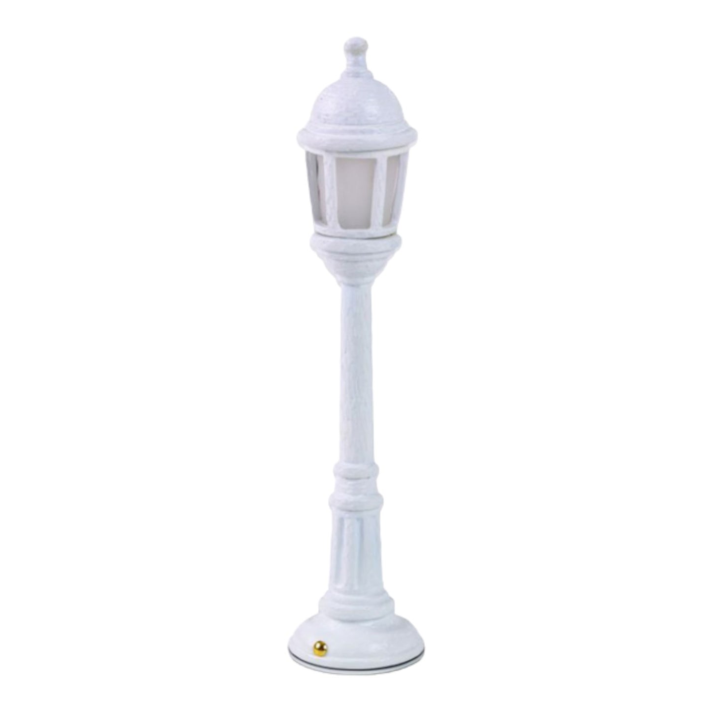 White decorative mini lamp post on a plain background.