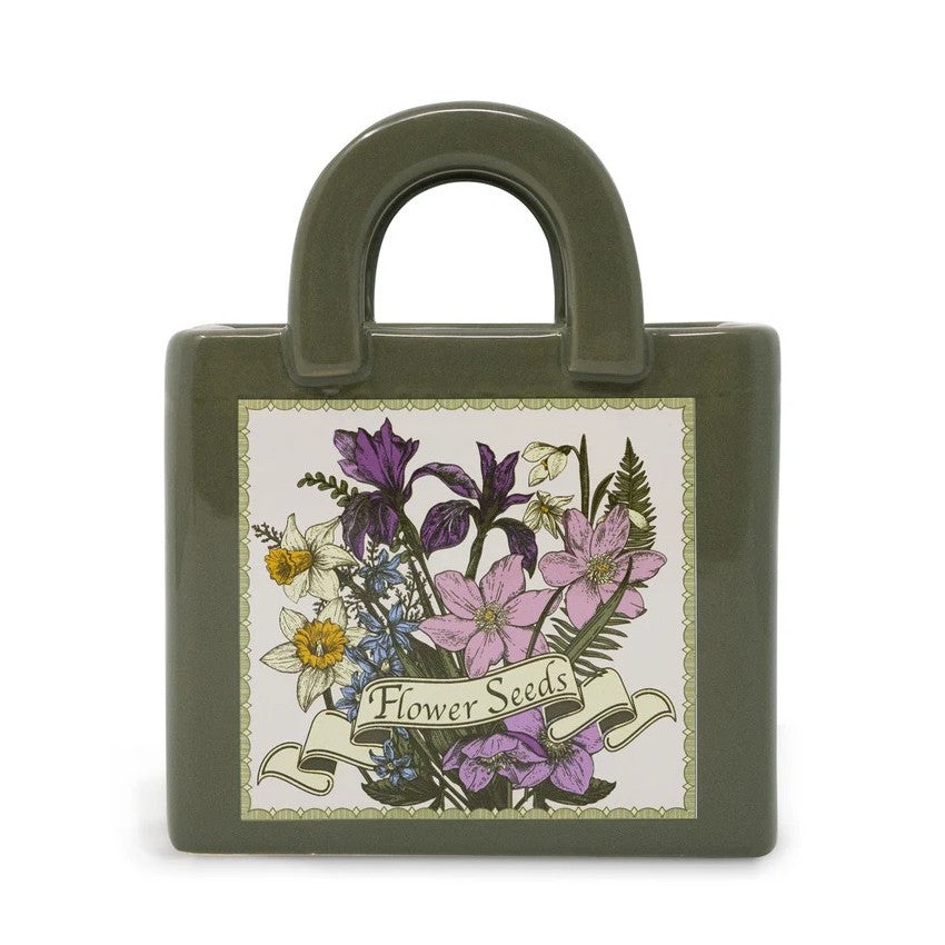 Green ceramic handbag vase with floral design.