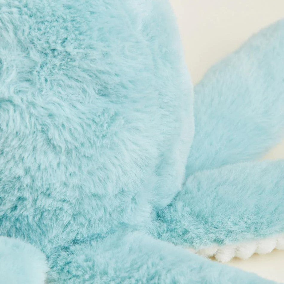 Close-up of a fluffy light blue stuffed animal.