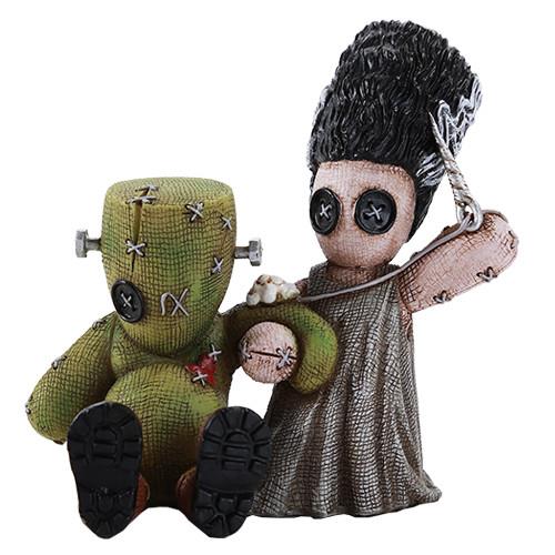 Cute plush dolls resembling a bride and Frankenstein monster.