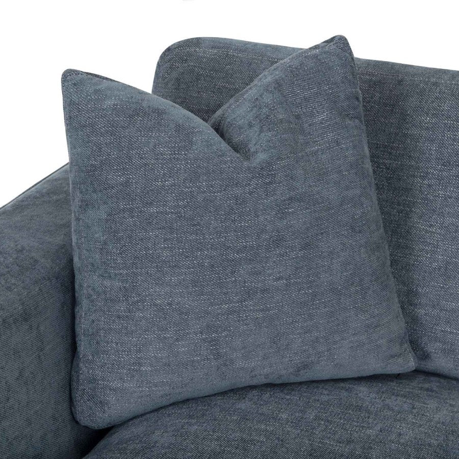 Dark gray textured cushion on a matching fabric sofa.