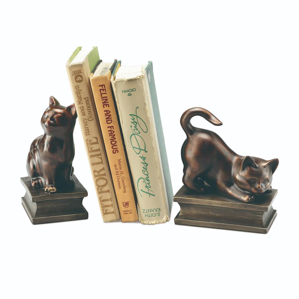 Cat-shaped bookends holding books upright.